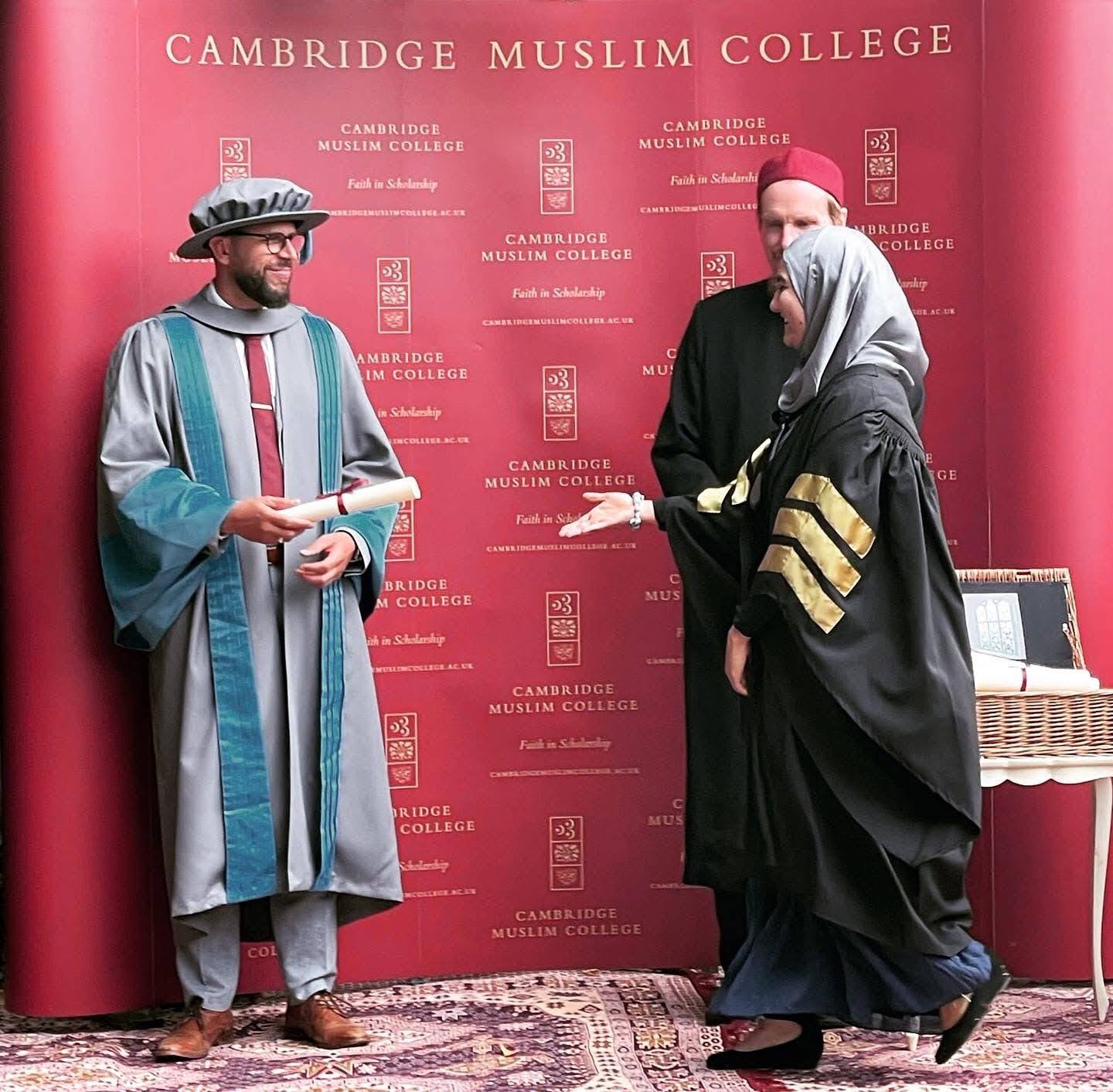 Kamela Salimi receiving her diploma from Dr. Abduallah Rothman and Abdulhakim Murad in Cambridge, UK.